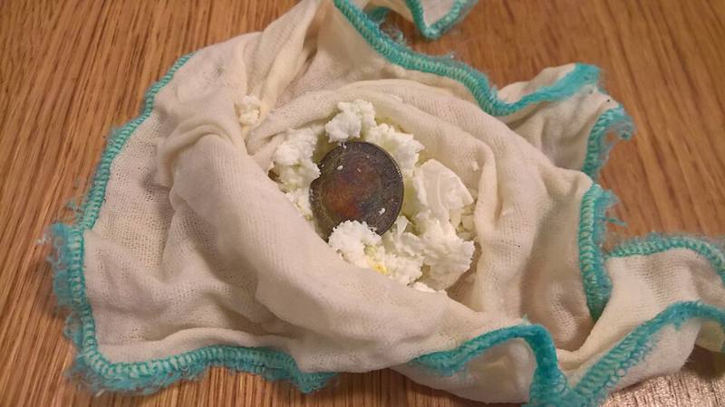 A silver coin of the kind traditionally used for body gua sha