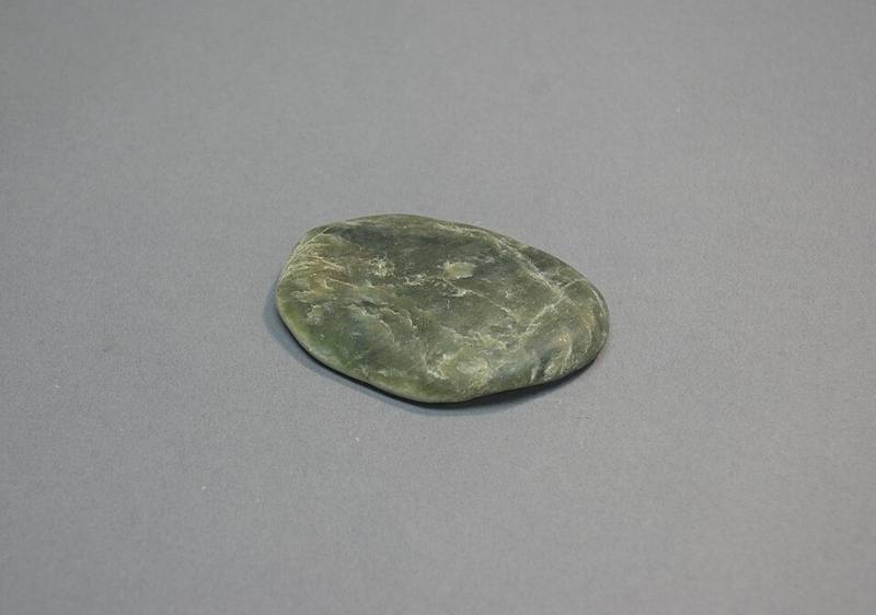 A smooth polished piece of nephrite jade